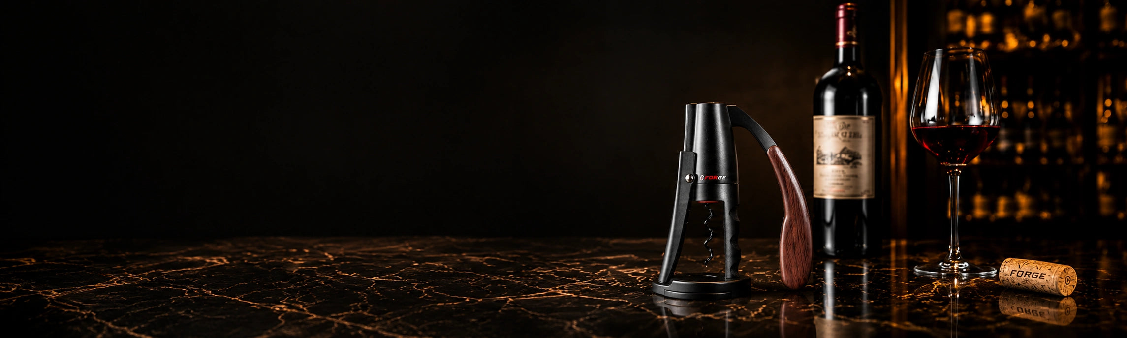 FORGE lever wine opener beside wine and crystal glassware