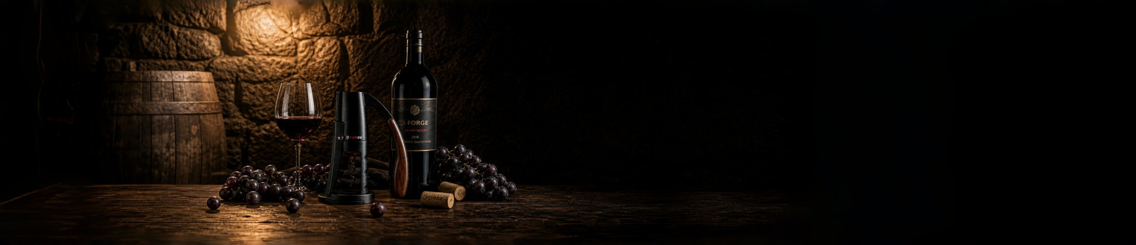 Red wine glass, grapes, and FORGE cork on dark wood