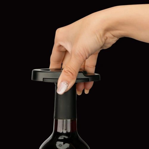 Using the foil cutter on a wine bottle